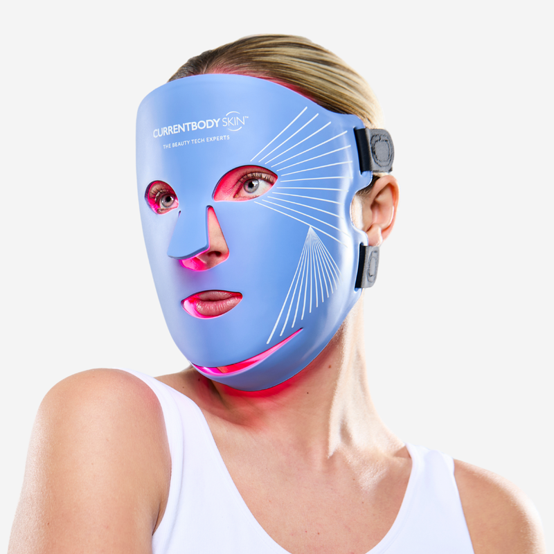 Woman using CurrentBody Blue Light LED Face Mask Series 2 on her face