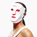 Woman using CurrentBody Red Light LED Face Mask Series 2 on her face