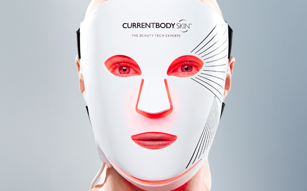Woman wearing the CurrentBody Skin LED Red Light Therapy Mask