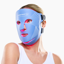 Woman using CurrentBody Blue Light LED Face Mask Series 2 on her face